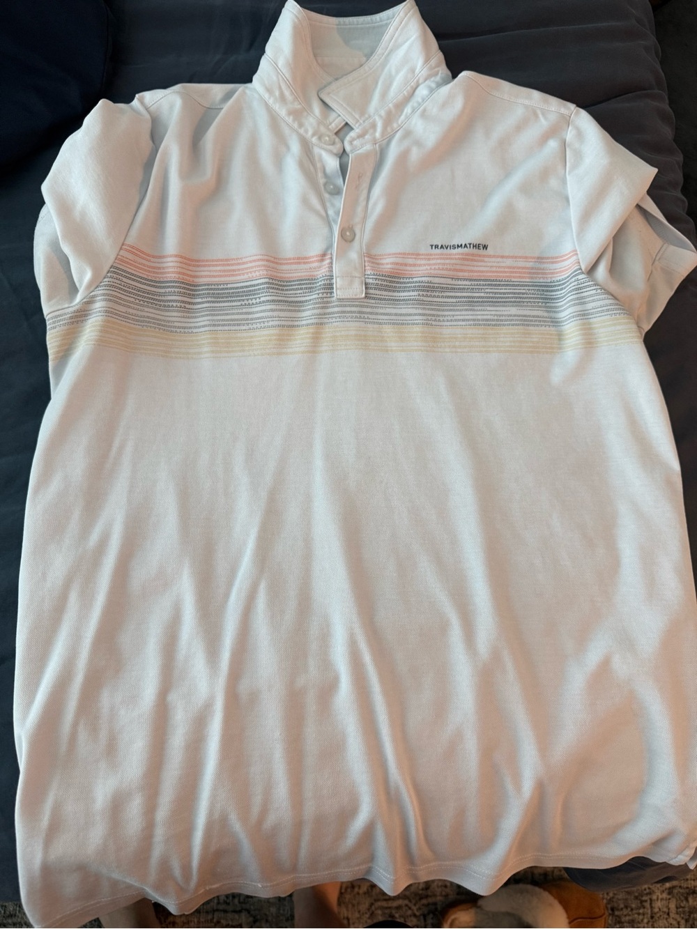Travis Mathew White Polo with Pastel Stripe Detail
